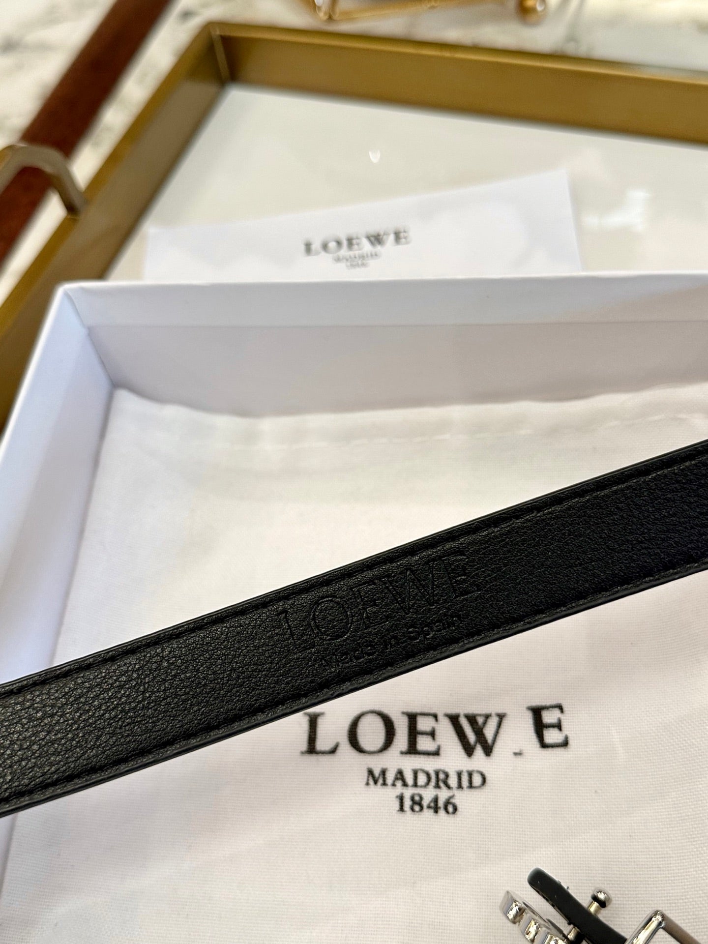 Loew belt Anagram buckle