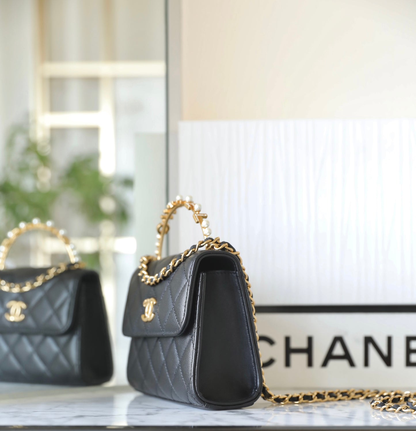 Chan New 23b mini kelly pearl handle bag